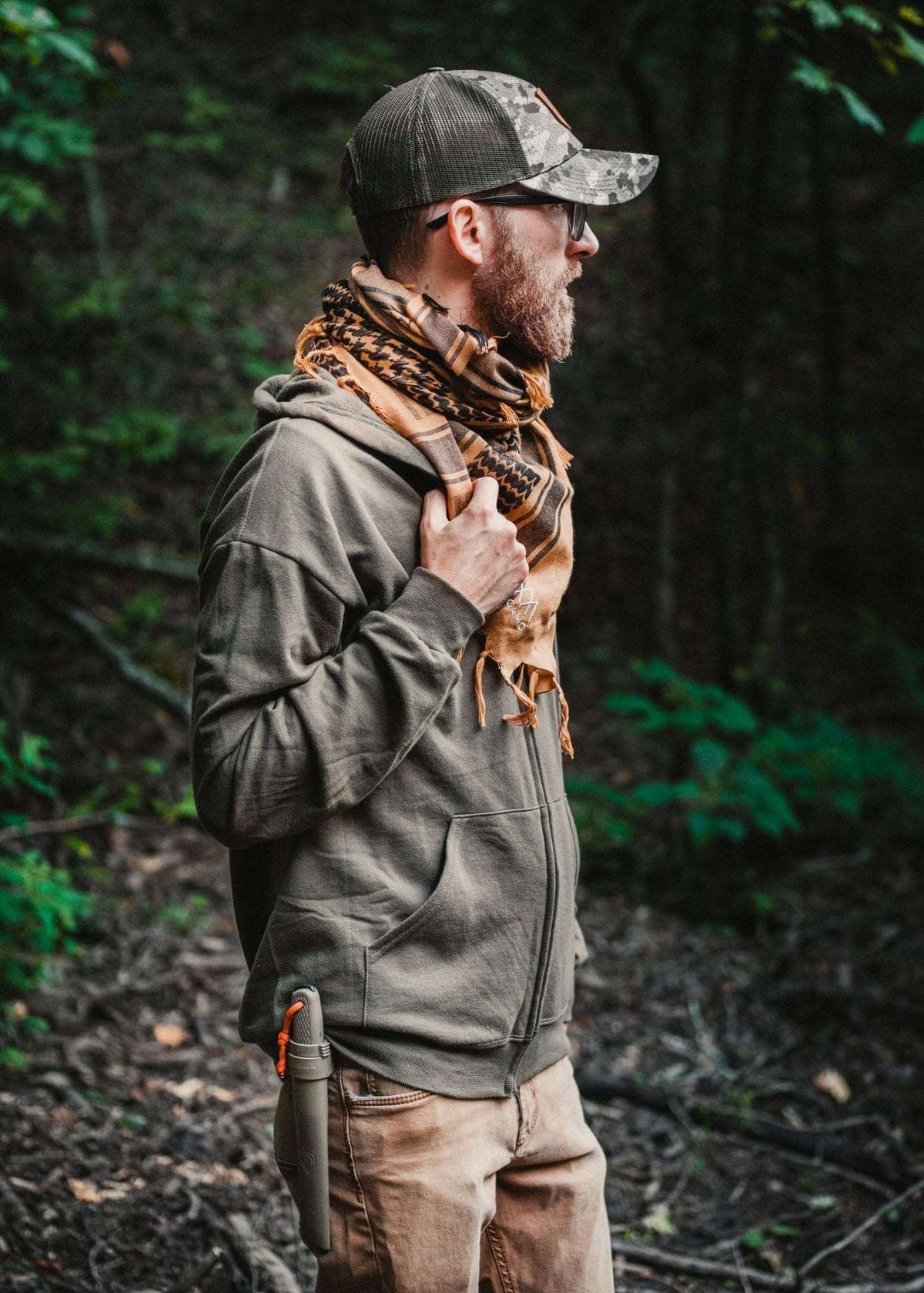 Tactical shemagh desert scarf worn by a person in an outdoor setting.