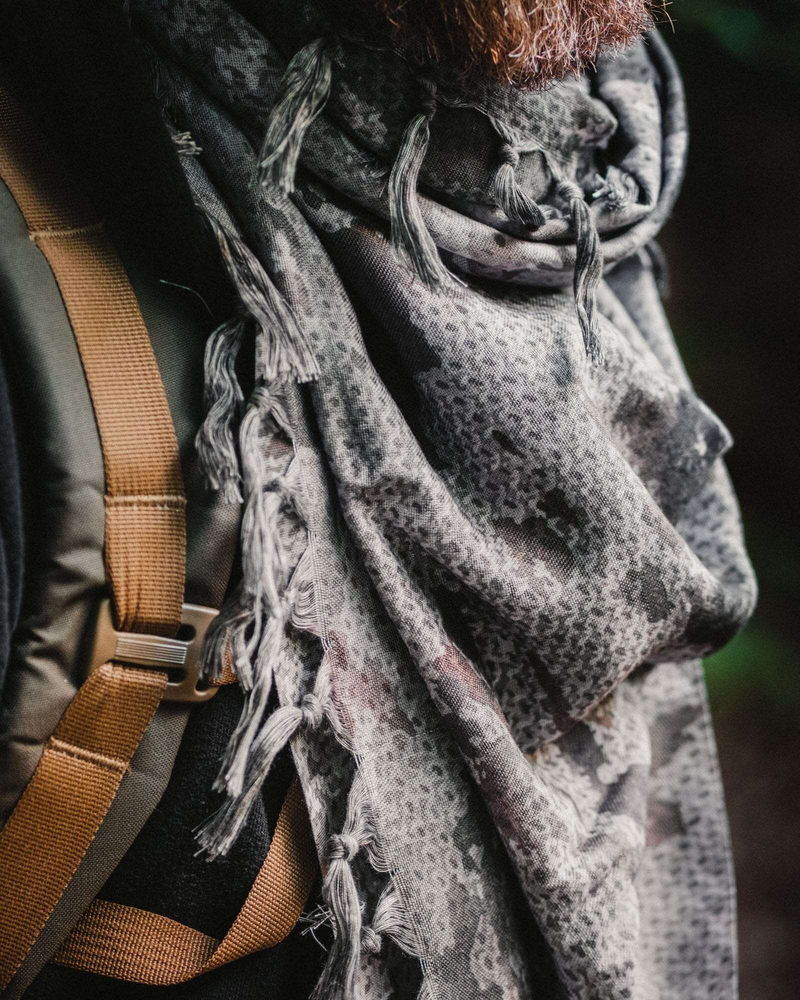 TACAMO® Shemagh Desert Scarf in SHROWD® Camouflage pattern, worn as a head wrap for tactical outdoor protection.