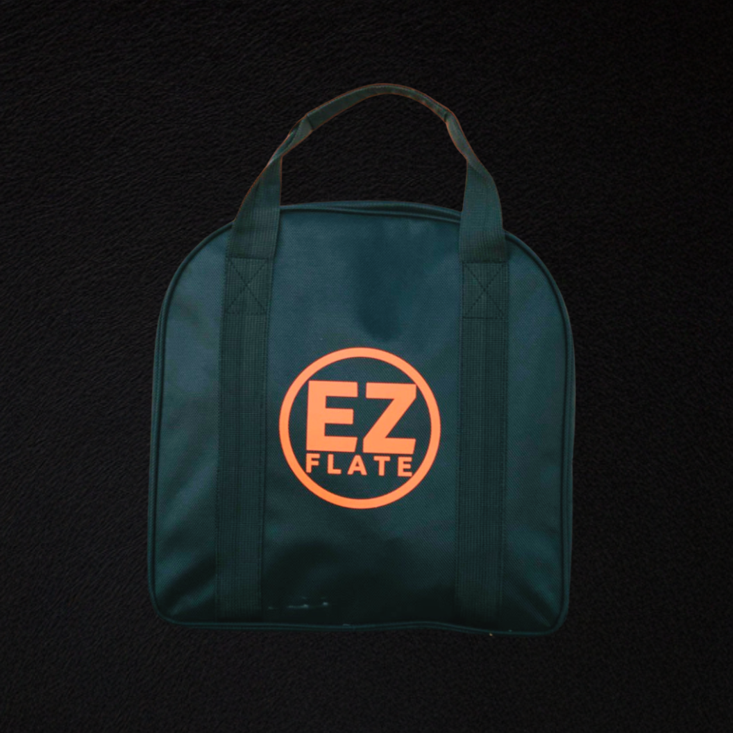 Green EZ Flate hose bag with handles on black background