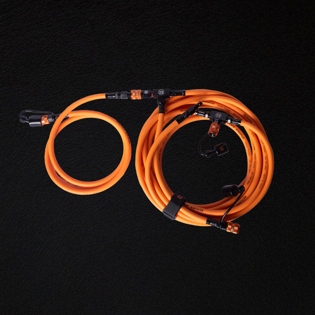 Hyperflex 6-way Hoses bright orange coiled set with connectors on black background