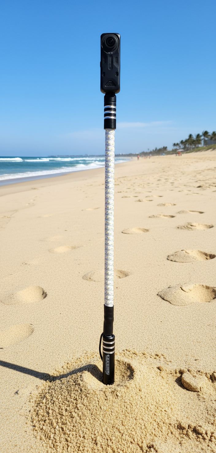 Insta 360 GoPro camera mount whip with LED support on beach sand