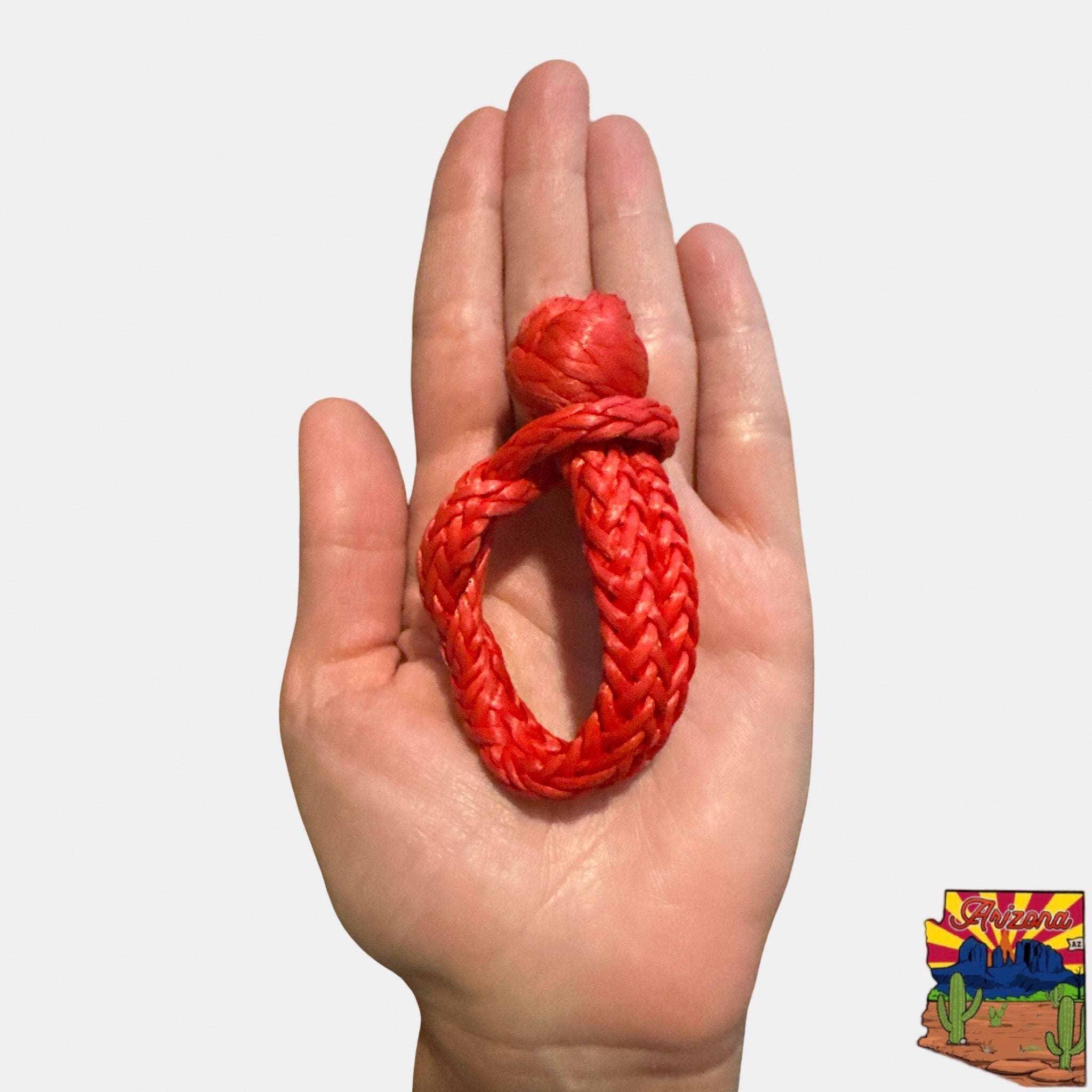Micro Soft Shackle 3/16" x 6" held in hand, red compact recovery shackle keychain tool