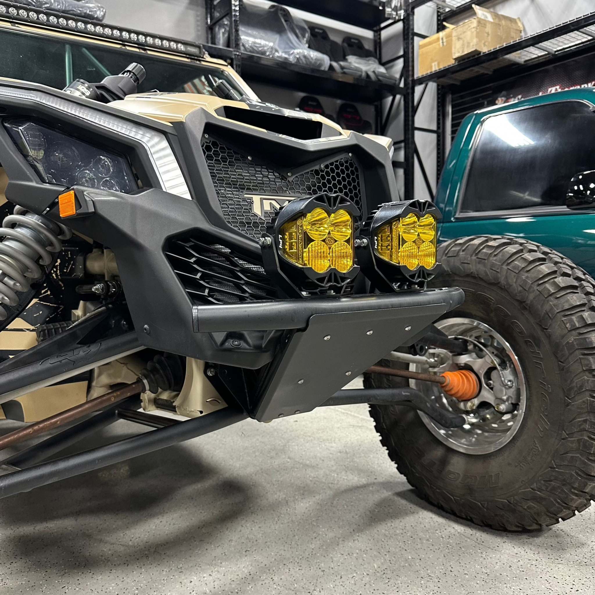 TMW X3 Prerunner front bumper installed on Can Am X3 with integrated tie down mounts and mounted lights in semi-gloss black finish