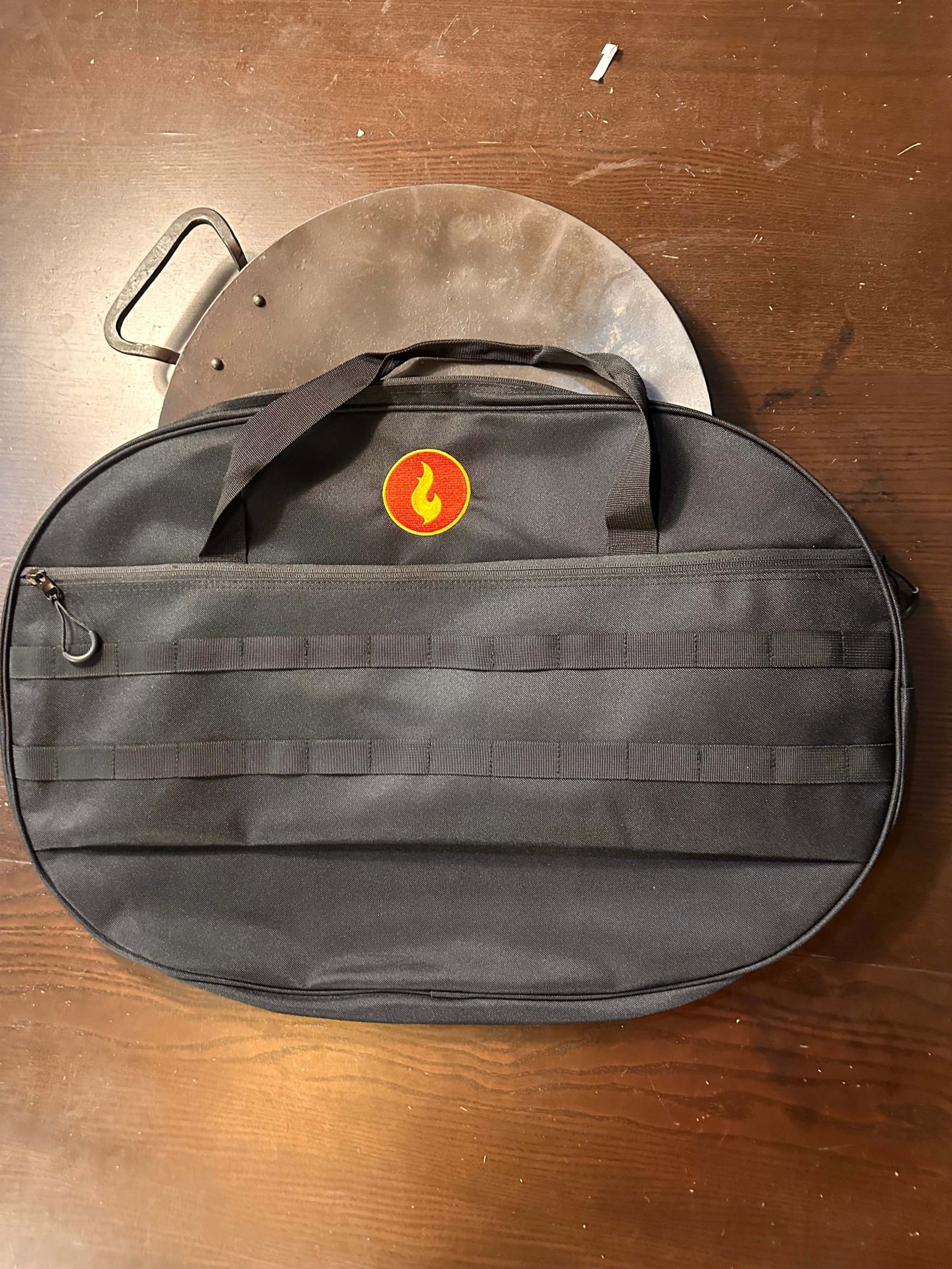 Black Skwok Bag with handles and front zipper pocket for kitchen tool storage