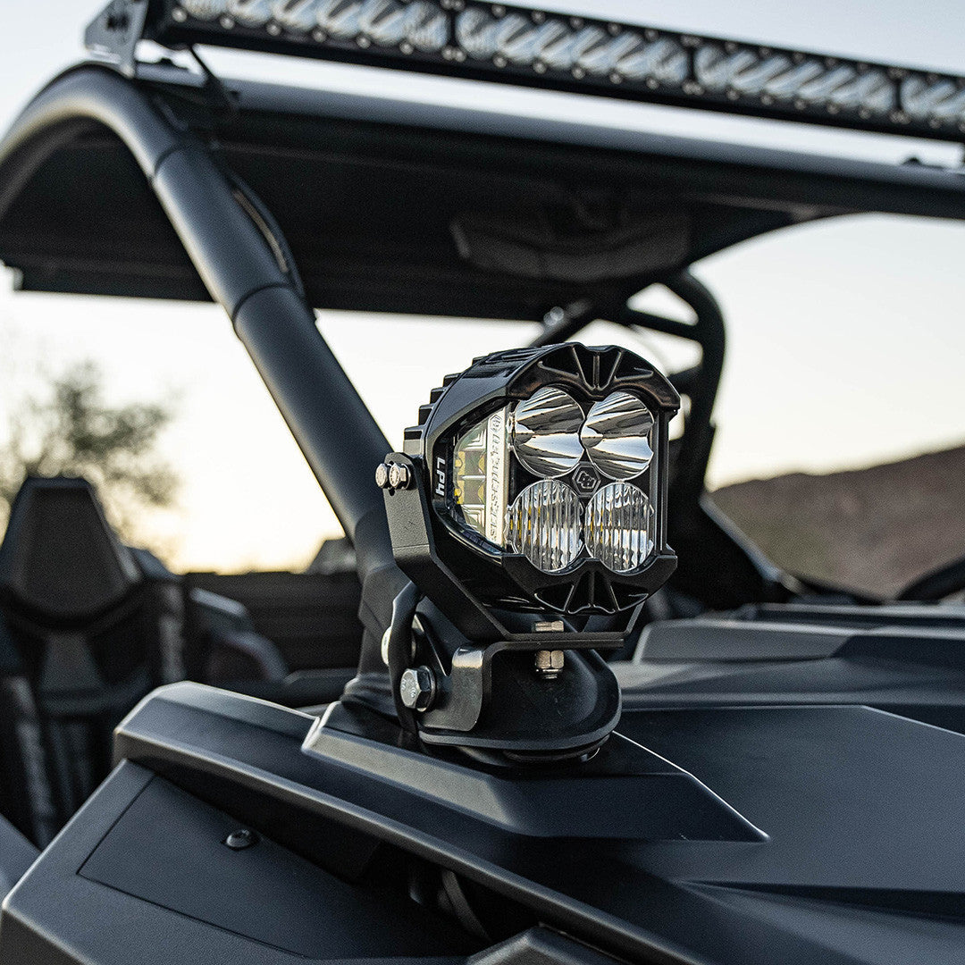 Baja Designs LP4 A-Pillar Light Kit mounted on Polaris RZR with bright LED lights and amber backlight