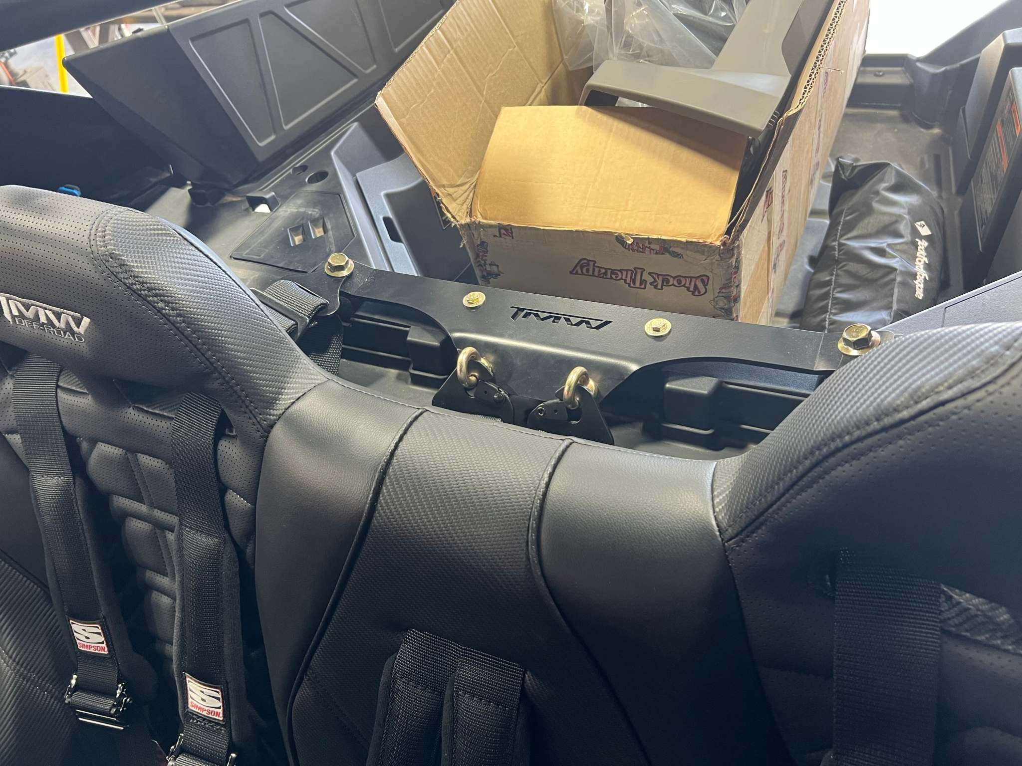 PRO R/Turbo R center harness mount installed on bench seat for secure middle harness attachment