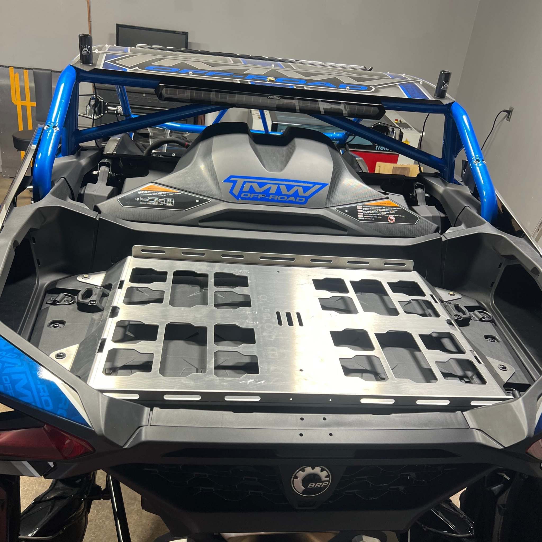 TMW Maverick R Packout rack made of lightweight, corrosion-resistant aircraft-grade aluminum with integrated tie-down rails and easy bolt-in installation for off-road vehicle bed.