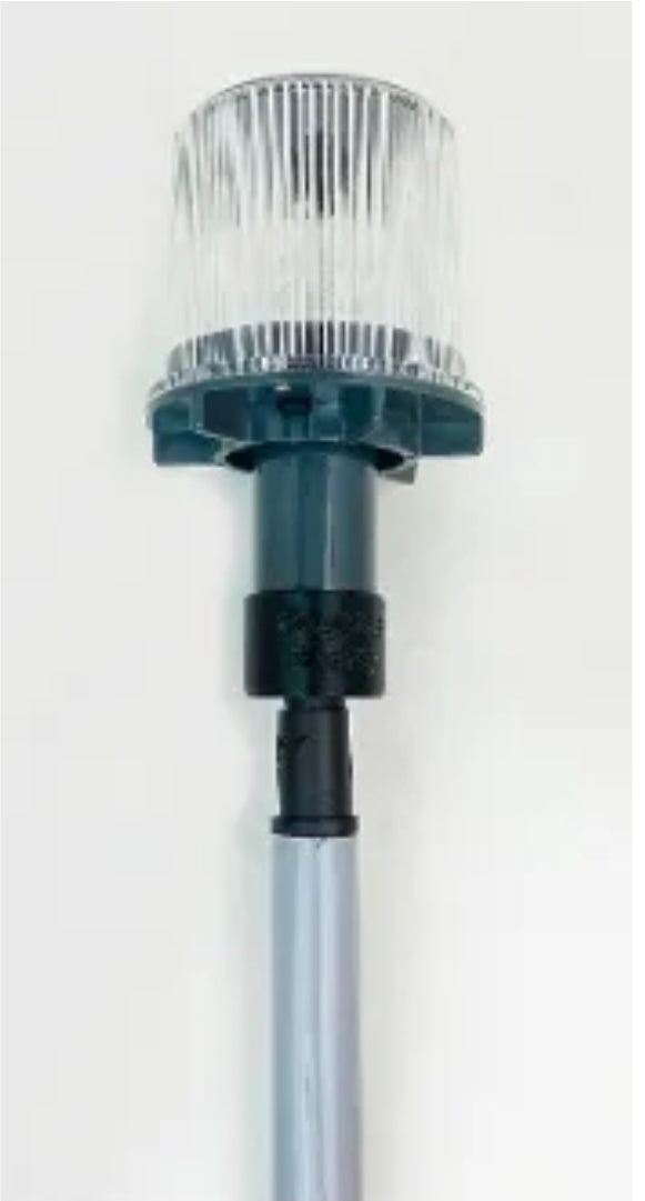 Red white blue solar beacon with clear top and black mounting base on silver pole
