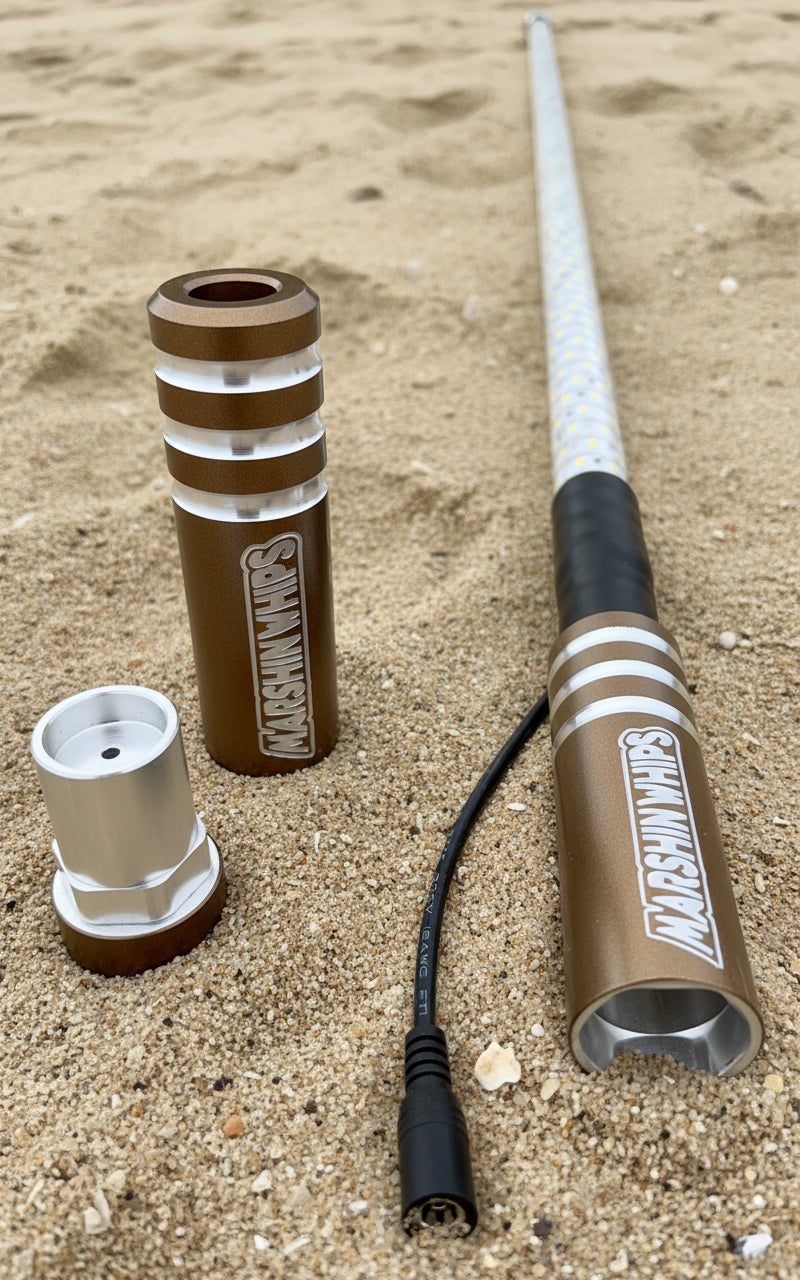 Game Changer Bronze Edition 5/8" Rod whip parts on sand with connector cable