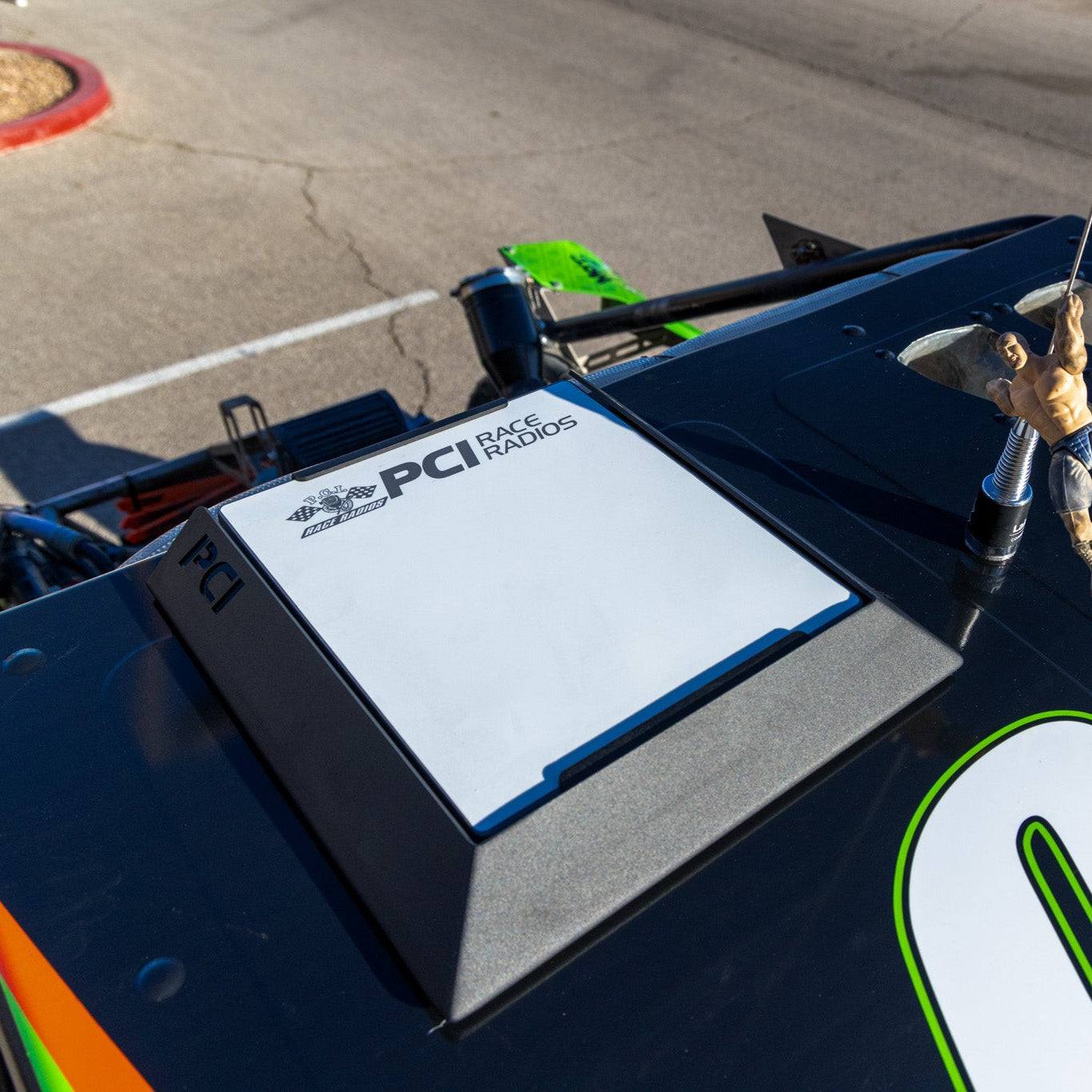 PCI Starlink Mini Race Bracket mounted on race car roof for stable Starlink dish connection in high-speed racing environments