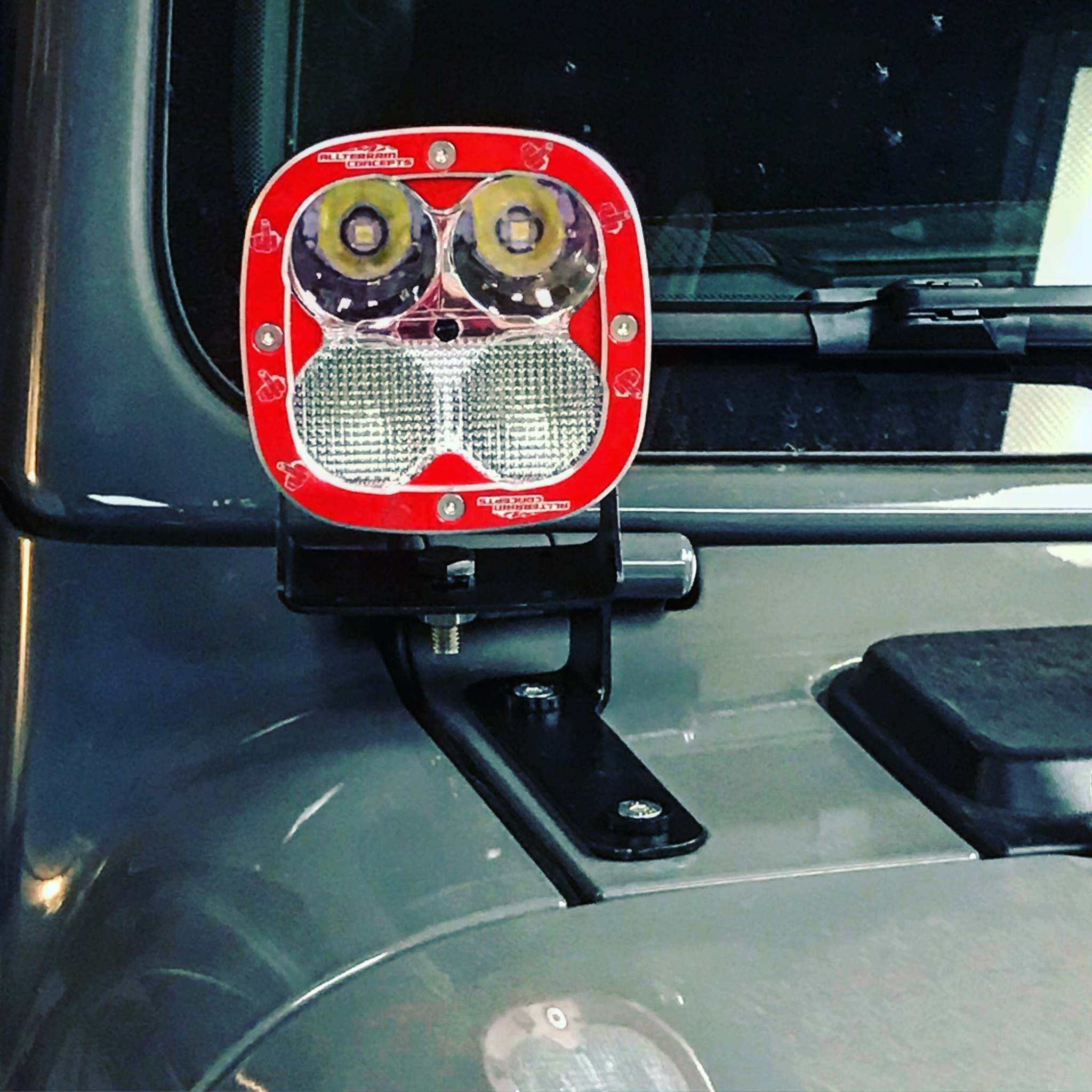 Jeep JL Ditch Bracket powder coated black installed with POD light on 2018+ Wrangler JL hood