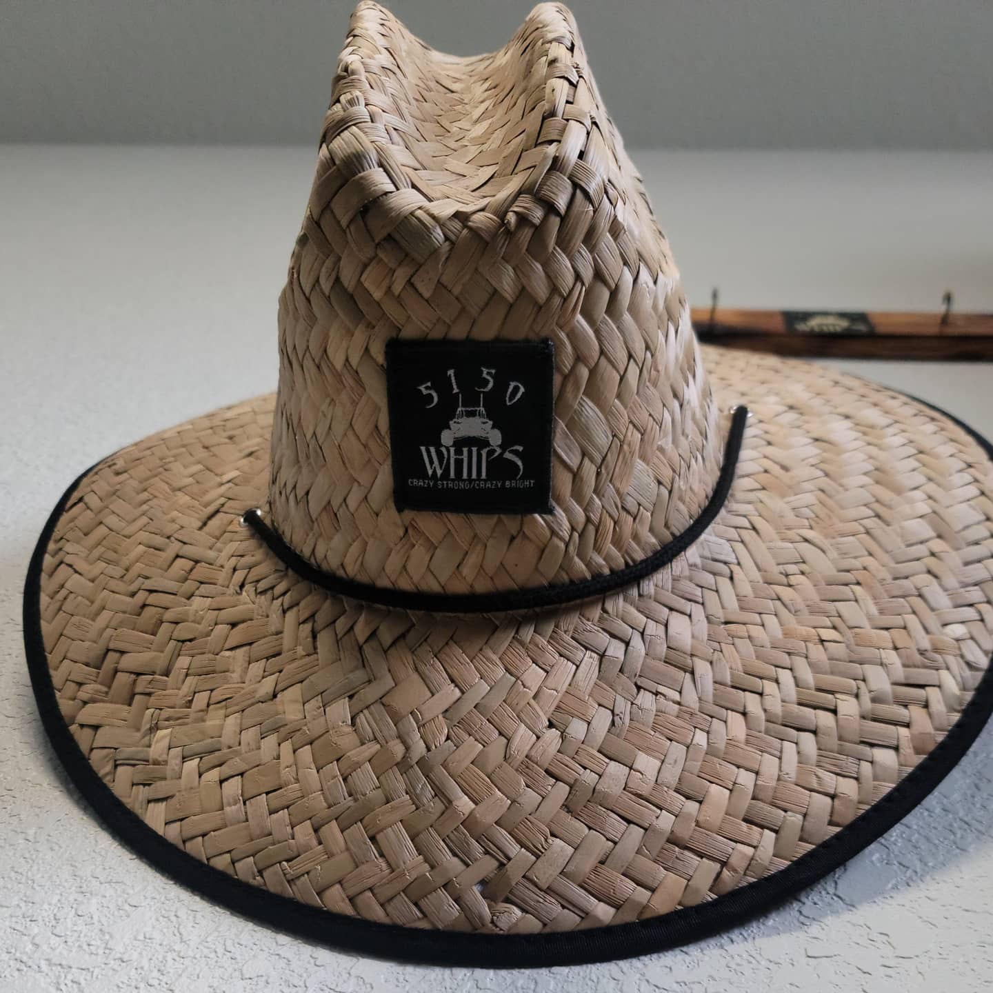 Custom straw hat with 5150 logo and black and white American flag brim